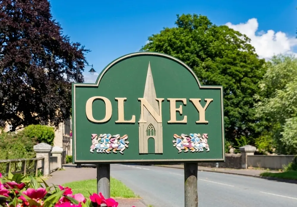 Olney Market Place and the spire of St Peter and St Paul Church by the Great Ouse